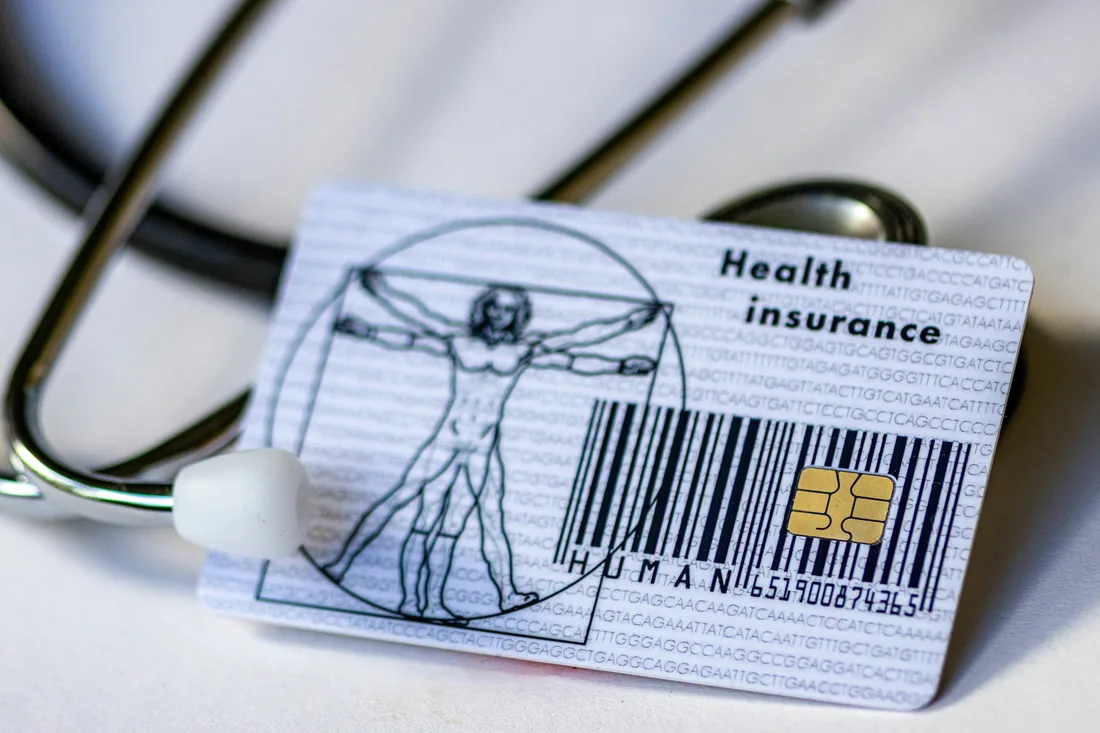 Health insurance card next to a stethoscope